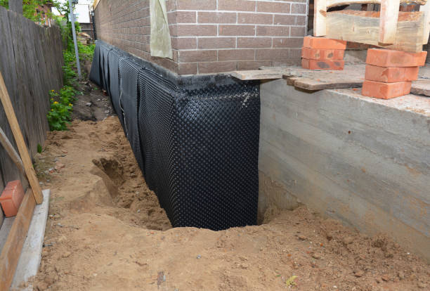 SJ Waterproofing Pros technician performing targeted Basement Waterproofing assessment in Branch, MI